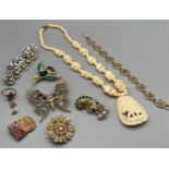 A Selection of vintage costume jewellery to include Trifari bird brooch, Brooches, Carved
