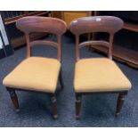 A Pair of splat back Victorian chairs with golden material seat.