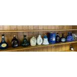 A Collection of empty whisky decanters to include Bells Queen Mother decanter- Full, sealed and