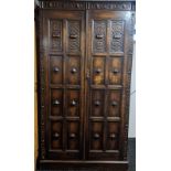 Jacobean style [C1900's] wardrobe, two moulded and fielded panel doors leading to interior shelf,