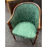 19th century parlour chair, the curved back above scroll arms and cushioned seat, raised on turned