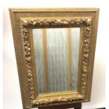 An 19th century heavy moulded and gilt painted mirror. [82x61cm]