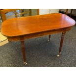 19th century table, the rounded rectangular top above a frieze, raised on turned legs, ending in