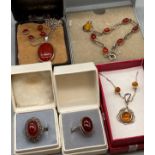 A Selection of Amber and Red stone silver jewellery to include Rings, bracelets and earring sets