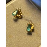 A Pair of 9ct yellow gold, diamond and Emerald earrings.