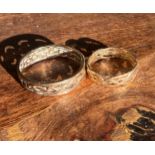 Two 9ct yellow gold his and hers Celtic design wedding bands. [His- Ring size X, Hers- Ring size