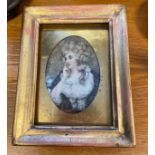 An 19th century hand painted miniature portrait. Fitted within a gilt frame. [Frame 17x13.5cm]