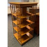 A 19th century large oak revolving bookcase. Finished with brass stud trims. [132x59.5x59.5cm]