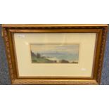 An original watercolour depicting a coastal scene with silhouette city in the background. Signed D.