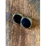 A Pair of 9ct gold and black onyx cufflinks. [9.96grams]