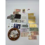 A Selection of mixed banknotes and coins.