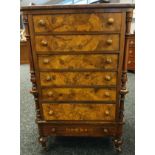 Georgian Burr Walnut and marquetry chest with a bank of six graduating drawers above a small