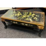 A Chinese lacquered and hand painted coffee table with glass top. [42x102x52cm]