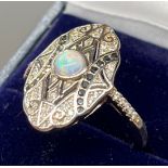 A Silver Art Deco style ring set with sapphires, CZ's and central opal. [Ring size O]