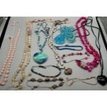 A Large collection of loose [29] hardstone Lola Rose London designer necklaces, pendants and