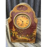 A Chinese Tole Ware hand painted tin clock case with a fitted clock. In a working condition [31cm in