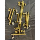A Quantity of antique brass door handles.