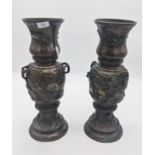 Pair of bronze Japanese Meiji vases, detailed with raised relief floral and bird design, signed to