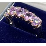 A Silver five stone Amethyst ring. [Ring size P]