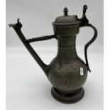 A 19th century pewter ewer/ spouted flagon detailing unusual arm support for spout. Possibly Swiss