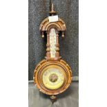 Antique wall barometer and thermometer.