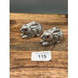 A Pair of well cast silver plated condiments in the form of Rabbits with ruby eyes.