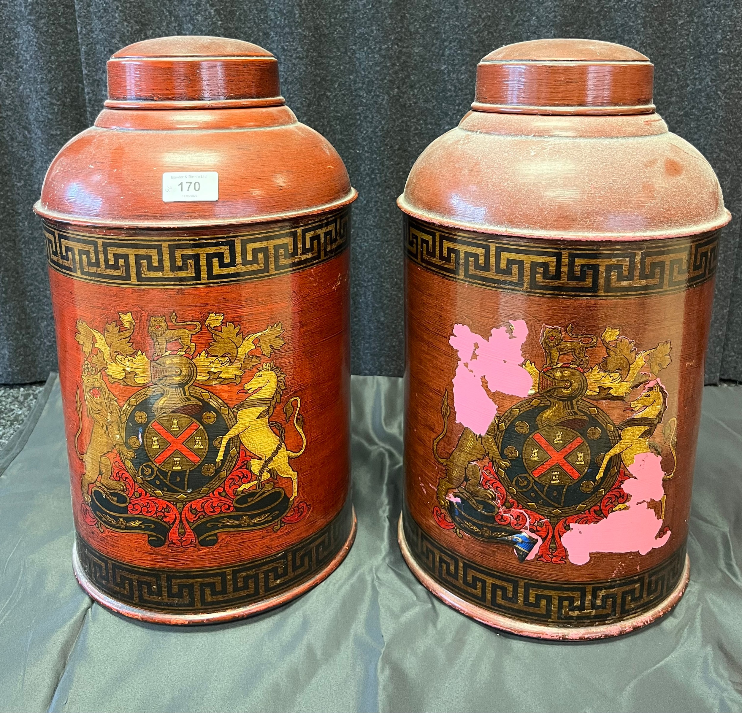 Two vintage tin painted and transfer storage pots with lids. [46cm in height]