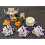 A Quantity of porcelain collectables to include ornate tea pot, cruet sets, floral design part tea