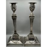 A pair of Georgian London silver candlesticks, highly detailed. Produced by Robert Jones & John