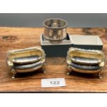 A Pair of Birmingham four foot salt dishes and Birmingham silver napkin ring with box.