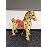 A Vintage child's tin plate Mobo rocking horse