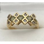 A Ladies 9ct yellow gold ring set with clear stones. [Ring size O] [2.73Grams]