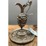 A Very unusual antique foreign white metal ewer. Highly detailed raised relief body depicting