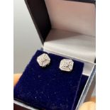 A Pair of 18ct white gold diamond cluster earrings of 39 points