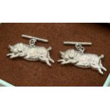 A Pair of silver pig cufflinks