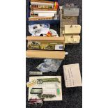 A Collection of partially built train model kits which includes blue prints, partially built