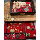 A Vintage jewel box containing a quantity of costume jewellery brooches, necklaces and bracelet etc