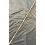 Antique tribal style walking stick fitted with metal bead mounts, Engraved to a panel 'V.R. Bromage,