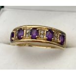 A Ladies 9ct yellow gold ring set with Amethysts and diamonds. [Ring size P] [3.31Grams]