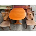 A mid century G- Plan teak dining table with 6 matching chairs