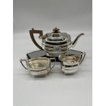 A Vintage CWF's E.P. Three piece tea service. Tea pot, sugar and cream.