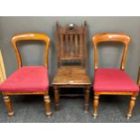 A 19th century oak chair together with a pair of mahogany framed chairs.