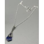 A Silver and marcasite art deco style lapis lazuli pendant and necklace.