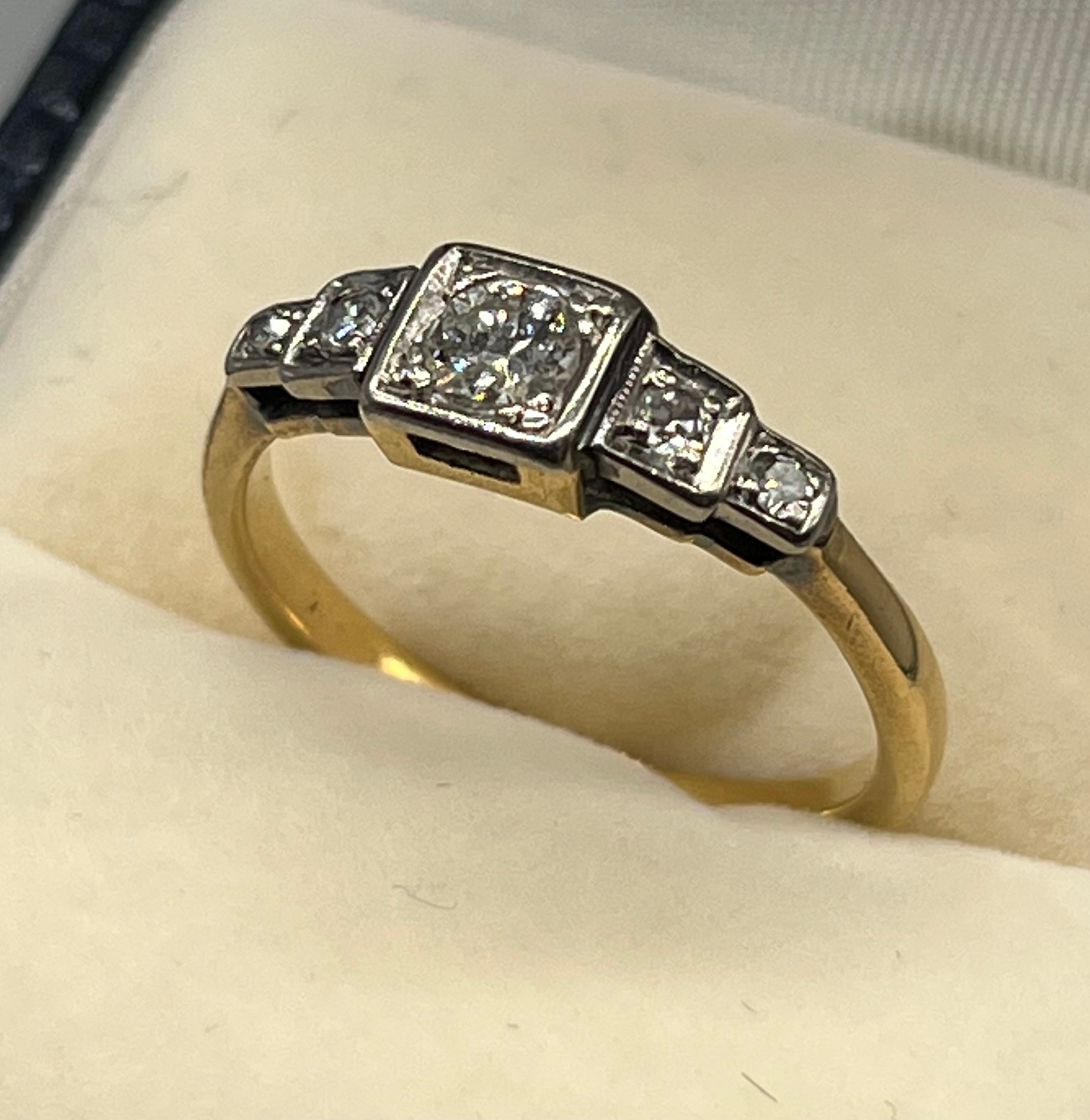 A Gold and diamond art deco ring. [0.34cts diamonds] [3.34grams] [Unmarked possibly 18ct gold]