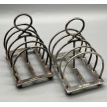 A Pair of Sheffield silver four slice toast racks. [181.92grams]