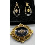 A Victorian Gold and enamelled mourning brooch together with a pair of matching earrings.