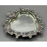 A Birmingham silver ornate heart shaped trinket dish. Has a glass insert. [Silver 80grams] [13.