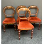 A lot of four 19th century balloon back dining chairs.