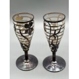 A Pair of Silver overlaid sherry glasses. [Unmarked] [9.5cm high]