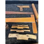 A Collection of vintage joiners tools to include wooden planes, set squares and clamp etc